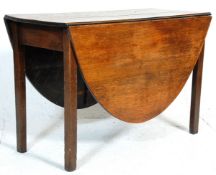 A 19th century George III solid mahogany gate leg /  drop leaf occasional dining table raised on