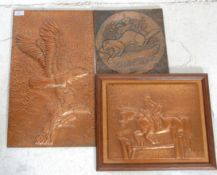 A mixed group of three retro 20th Century hand worked copper panels to include one of an eagle
