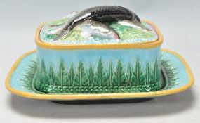A 19th Century George Jones majolica sardine dish and cover consisting of a square dish with