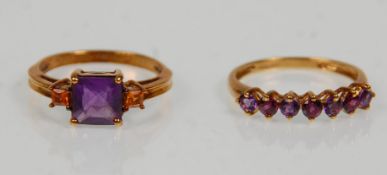 Two hallmarked 9ct yellow gold ladies rings. One set with a row of seven round faceted cut purple