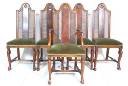 A set of five 1920's Art Deco dining chairs each having elongated back rests with canes panels and