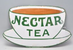 A vintage enamel advertising sign for 'Nectar Tea' in the form of a teacup and saucer. 32cm x 53cm.