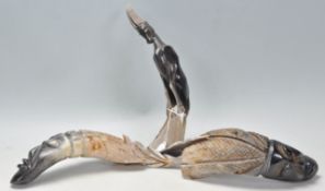 A good group of three retro 20th Century carved horn figures one in the form of an Antelope and