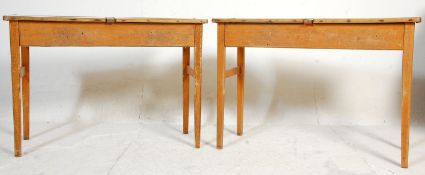 A pair of retro mid century, circa 1950's school desks. Each raised on squared legs with returns