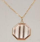 A hallmarked 9ct yellow gold locket pendant of octagonal form having engine turned decoration.