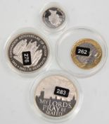 A group of four English silver coins to include a silver proof 1995 one pound coin, 1993 40th