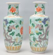 A pair of late 19th / early 20th Century Chinese baluster vases having hand enamelled decoration