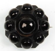 A good 19th Century Victorian large vintage Whitby Jet brooch of octagonal form having ball