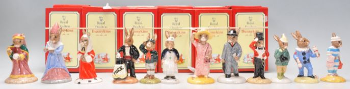 A collection of twelve Royal Doulton Bunnykins rabbit figurines to include Fortune Teller