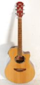 A Yamaha APX500 acoustic and electric six string guitar having chrome tuning pegs with with mother