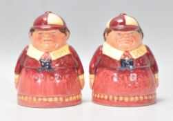 Alice In Wonderland - A pair of Royal Doulton ceramic Tweedle Dum and Tweedle Dee salt and pepper