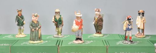 A group of seven Beswick ceramic figurines to include Huntsman Fox, the Lady Pig, Fisherman Otter,