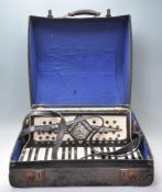 A vintage 1930's Italian Geraldo Standard accordion having a celluloid case having 34 black and