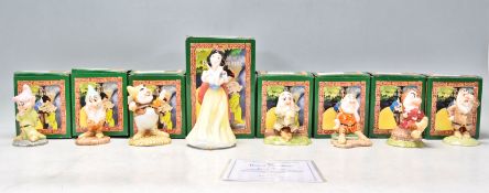 A complete set of eight Royal Doulton ceramic figures for the snow white series 616 to include