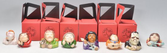 A collection of eight mostly music related ceramic Kevin Francis face pots to include David