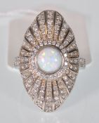 A stamped 925 silver Art Deco ring having a navette shaped panel set with white stones and a round