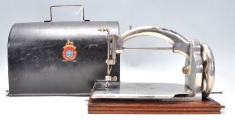 A great vintage early 20th Century Ideal Sewing Machine raised on an oak plinth base with metal