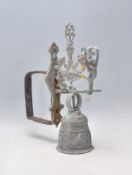 A 19th Century Victorian wall mounting bell having scrolled acanthus leaf decoration to the bell