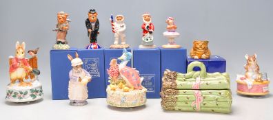 A mixed group of mostly ceramic figures a Beswick Mrs Rabbit Baking ECF 7 and other Beatrix Potter