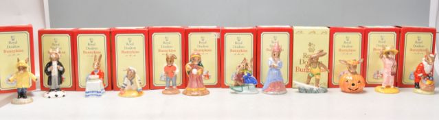 A group of twelve Royal Doulton Bunnykins ceramic figurines to include Rainy Day DB 147, Lawyer
