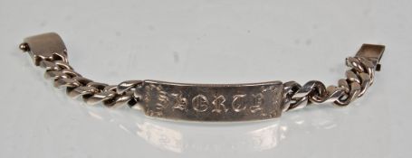 A thick and heavy English silver hallmarked gentlemens flat link identity bracelet having an