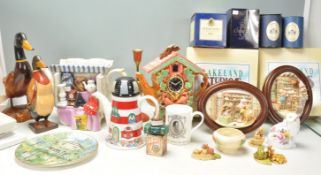 A large mixed group of mostly ceramic wares / ornaments to include 2x wooden ducks, lighthouse