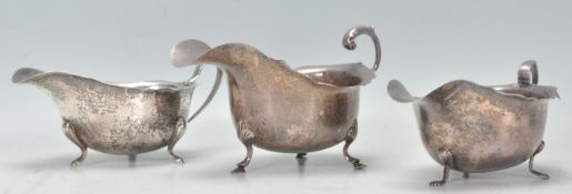 A group of three silver hallmarked sauce boats of