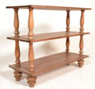 A contemporary 20th century 3 tier solid teak wood