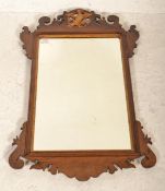 An Edwardian mahogany pier mirror having upright m