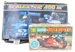 TWO VINTAGE SCALEXTRIC SLOT CAR SETS