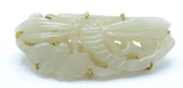 An antique Chinese jade 14ct gold large dragonfly brooch.