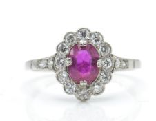 An 18ct white gold ruby and diamond ring