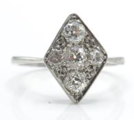 A French platinum, gold and diamond ring. The ring