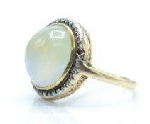 A 14ct gold diamond and bi-coloured quartz cabochon ring.