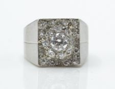 with halo of diamonds and pave set mount with stylised shoulders and French alsatian mark to outside