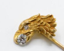 An 18ct gold and diamond figural eagle stick pin.