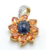 A hallmarked 9ct gold sapphire and diamond pendant
