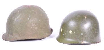 UNIFORMS AND FANCY DRESS - A PAIR OF METAL POST WWII AMERICAN COMBAT HELMETS.