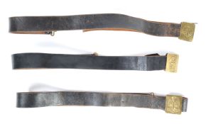 UNIFORM AND FANCY DRESS - A GROUP OF THREE LEATHER MILITARY STYLE BELTS.