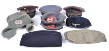 Fancy dress - A collection of eight 20th post WWII genuine military and air force hats and berets,