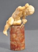 19TH CENTURY CARVED IVORY STONEMASON CHERUB