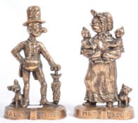 RARE PAIR OF MR & MRS SLOPER CAST IRON DOOR STOPS