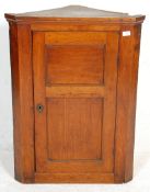 A 19th Century George III golden oak hanging corne