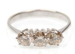58 An 18ct white gold three stone ring set with th