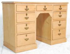 A 20th century pine twin pedestal desk. Raised on