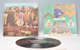 A vinyl long play LP record album by The Beatles –