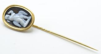 An antique gold cameo stickpin. The stickpin set w