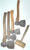 A group of four vintage hand axes together with an old wooden mallet. Some axes bearing names to