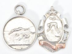 Two early 20th Century silver hallmarked swimming medals awarded to a J James dated 1915 and 1914