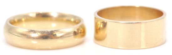 2 hallmarked 9ct gold band rings. One hallmarked for London 1986, sponsors mark SJ, weight 3.74g